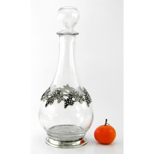 Bottle with raisins in pewter